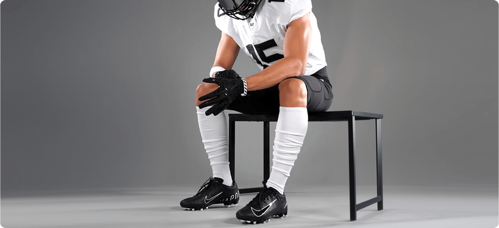 Sleeves — Seated Football Player Studio Portrait